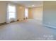 Spacious living room with neutral carpet at 44101 Millingport Rd, Richfield, NC 28137