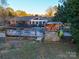 Backyard with pool, deck, and wooden pool bar at 44101 Millingport Rd, Richfield, NC 28137