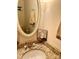 Clean bathroom with granite countertop, oval mirror, and decorative artwork at 4618 Old Lantern Way, Charlotte, NC 28212