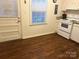 Kitchen with white appliances and wood floor at 4618 Old Lantern Way, Charlotte, NC 28212