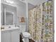 Bathroom with white vanity and floral shower curtain at 6012 Sapwood Ct, Matthews, NC 28104