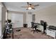 Spacious bedroom with two workspaces and ceiling fan at 6012 Sapwood Ct, Matthews, NC 28104