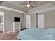 Spacious bedroom with ceiling fan and ample closet space at 6012 Sapwood Ct, Matthews, NC 28104