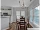 Cozy dining area featuring hardwood floors and a chandelier at 6012 Sapwood Ct, Matthews, NC 28104