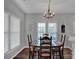 Bright dining area with hardwood floors and large windows at 6012 Sapwood Ct, Matthews, NC 28104