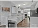 Modern eat-in kitchen with stainless steel appliances and white cabinets at 6012 Sapwood Ct, Matthews, NC 28104