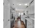 Bright kitchen featuring stainless steel appliances and white cabinets at 6012 Sapwood Ct, Matthews, NC 28104