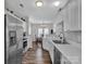 Modern kitchen with stainless steel appliances and white cabinets at 6012 Sapwood Ct, Matthews, NC 28104