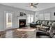 Spacious living room with a fireplace and comfortable sectional sofa at 6012 Sapwood Ct, Matthews, NC 28104