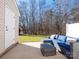 Private patio with sectional sofa and glass-top coffee table at 6012 Sapwood Ct, Matthews, NC 28104