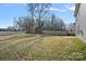 Backyard with wooden fence and trees at 709 Ferrell Ave, Charlotte, NC 28216