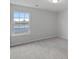 Bright bedroom with a window offering a view at 709 Ferrell Ave, Charlotte, NC 28216