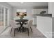 Bright dining area with four chairs and access to the backyard at 709 Ferrell Ave, Charlotte, NC 28216