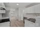 Modern kitchen with white cabinets and stainless steel appliances at 709 Ferrell Ave, Charlotte, NC 28216