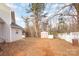 Backyard with shed, trees, and wooden fence at 9005 Jaldena Dr, Charlotte, NC 28227