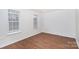 Bedroom with neutral walls and wood-look flooring at 9005 Jaldena Dr, Charlotte, NC 28227