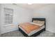 Bedroom with a double bed, neutral walls, and carpet at 9005 Jaldena Dr, Charlotte, NC 28227