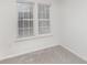 Well-lit bedroom with neutral walls and carpeting at 9005 Jaldena Dr, Charlotte, NC 28227