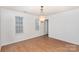 Simple dining room with hardwood floors and a chandelier at 9005 Jaldena Dr, Charlotte, NC 28227