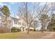 Two-story house with gray siding, dark shutters, and a tree-lined yard at 9005 Jaldena Dr, Charlotte, NC 28227