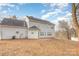 Rear view of two-story house, gray siding at 9005 Jaldena Dr, Charlotte, NC 28227