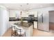 Kitchen with granite island, white cabinets, and stainless steel appliances at 9005 Jaldena Dr, Charlotte, NC 28227