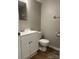 Clean bathroom with white vanity, toilet and gray flooring at 9401 Old Concord Rd # A, Charlotte, NC 28213