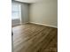 Spacious bedroom with wood-look floors and neutral walls at 9401 Old Concord Rd # A, Charlotte, NC 28213