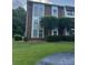 Brick condo building with landscaping and trees at 9401 Old Concord Rd # A, Charlotte, NC 28213