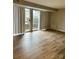 Spacious living room with wood-look floors and sliding doors at 9401 Old Concord Rd # A, Charlotte, NC 28213