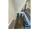 Clean condo interior stairwell with blue railings at 9401 Old Concord Rd # A, Charlotte, NC 28213