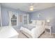 Serene bedroom with white bedding and light decor at 9729 Cockerham Ln, Huntersville, NC 28078