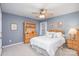 Cozy bedroom with light walls and ceiling fan at 9729 Cockerham Ln, Huntersville, NC 28078