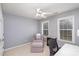 Bright bedroom with a desk and seating area at 9729 Cockerham Ln, Huntersville, NC 28078