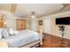 Spacious primary bedroom with hardwood floors and large wardrobe at 9729 Cockerham Ln, Huntersville, NC 28078