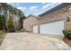 Two-car garage with a spacious driveway at 9729 Cockerham Ln, Huntersville, NC 28078