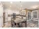 Modern kitchen with white cabinets, granite countertops, and stainless steel appliances at 9729 Cockerham Ln, Huntersville, NC 28078