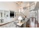 Living room with hardwood floors, a fireplace, and an open staircase at 9729 Cockerham Ln, Huntersville, NC 28078