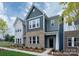 Two story townhome with gray and brick exterior at 1108 Verdigris Dr # 802/0802, Gastonia, NC 28054