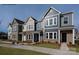 Two story townhouses with neutral siding and landscaping at 1108 Verdigris Dr # 802/0802, Gastonia, NC 28054