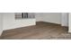 Open living space with hardwood floors and kitchen view at 1108 Verdigris Dr # 802/0802, Gastonia, NC 28054