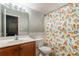 Clean bathroom with orange floral shower curtain and wood vanity at 1147 Wagner Ave, Fort Mill, SC 29715