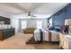 Main bedroom with ceiling fan, blue accent wall, and sitting area at 1147 Wagner Ave, Fort Mill, SC 29715