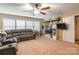 Spacious bonus room, perfect for entertainment, features a large sectional sofa and plenty of natural light at 1147 Wagner Ave, Fort Mill, SC 29715