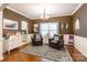 Cozy dining area featuring hardwood floors, two leather armchairs, and a decorative rug at 1147 Wagner Ave, Fort Mill, SC 29715