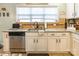 Kitchen features granite countertops and white cabinets at 1147 Wagner Ave, Fort Mill, SC 29715