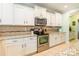 Modern kitchen with stainless steel appliances and granite countertops at 1147 Wagner Ave, Fort Mill, SC 29715