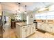 Open kitchen with island, granite countertops, and view to dining area at 1147 Wagner Ave, Fort Mill, SC 29715