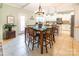 Kitchen with an island, white cabinets, and a dining area at 1147 Wagner Ave, Fort Mill, SC 29715