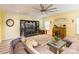 Living room featuring a sectional sofa, built-in shelving, and a ceiling fan at 1147 Wagner Ave, Fort Mill, SC 29715